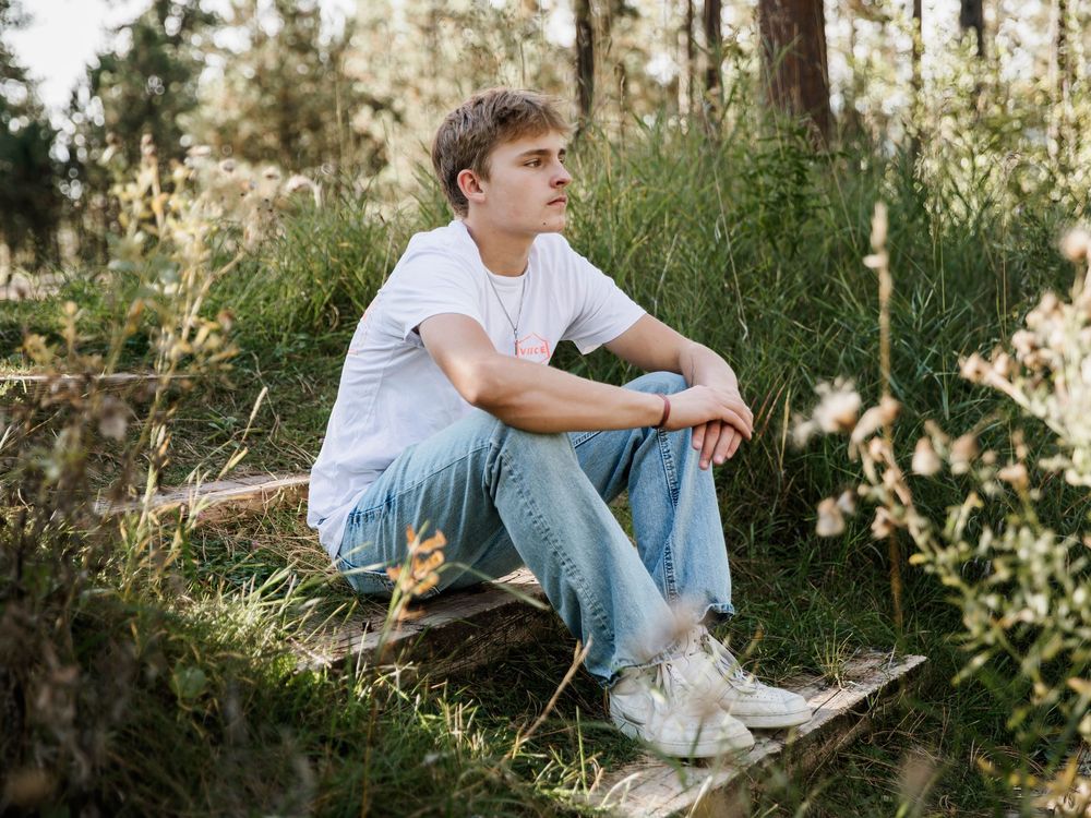 Multiple outdoor poses captured in a wooded setting with natural lighting.