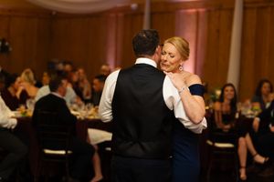 A couple shares a dance together at their wedding reception.