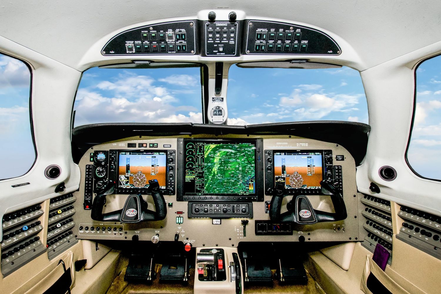 Modern aircraft cockpit with advanced digital flight instruments and navigation displays.