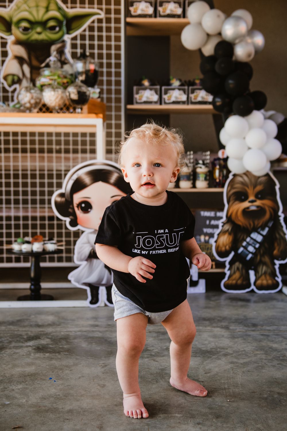 Baby celebrating their 1st birthday with a fun Star Wars theme.
