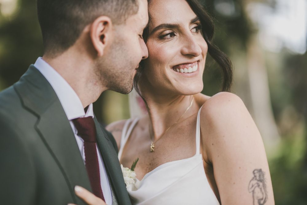 Newlyweds posing for wedding pictures.