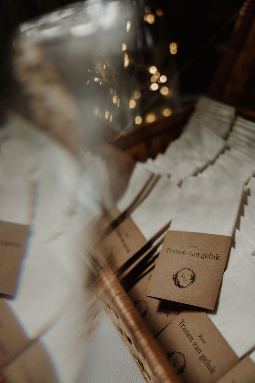 Artisanal brown paper products with bokeh lighting effects in moody atmospheric photography.
