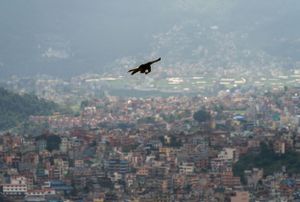 Panoramic view of Kathmandu city with mountains in background.