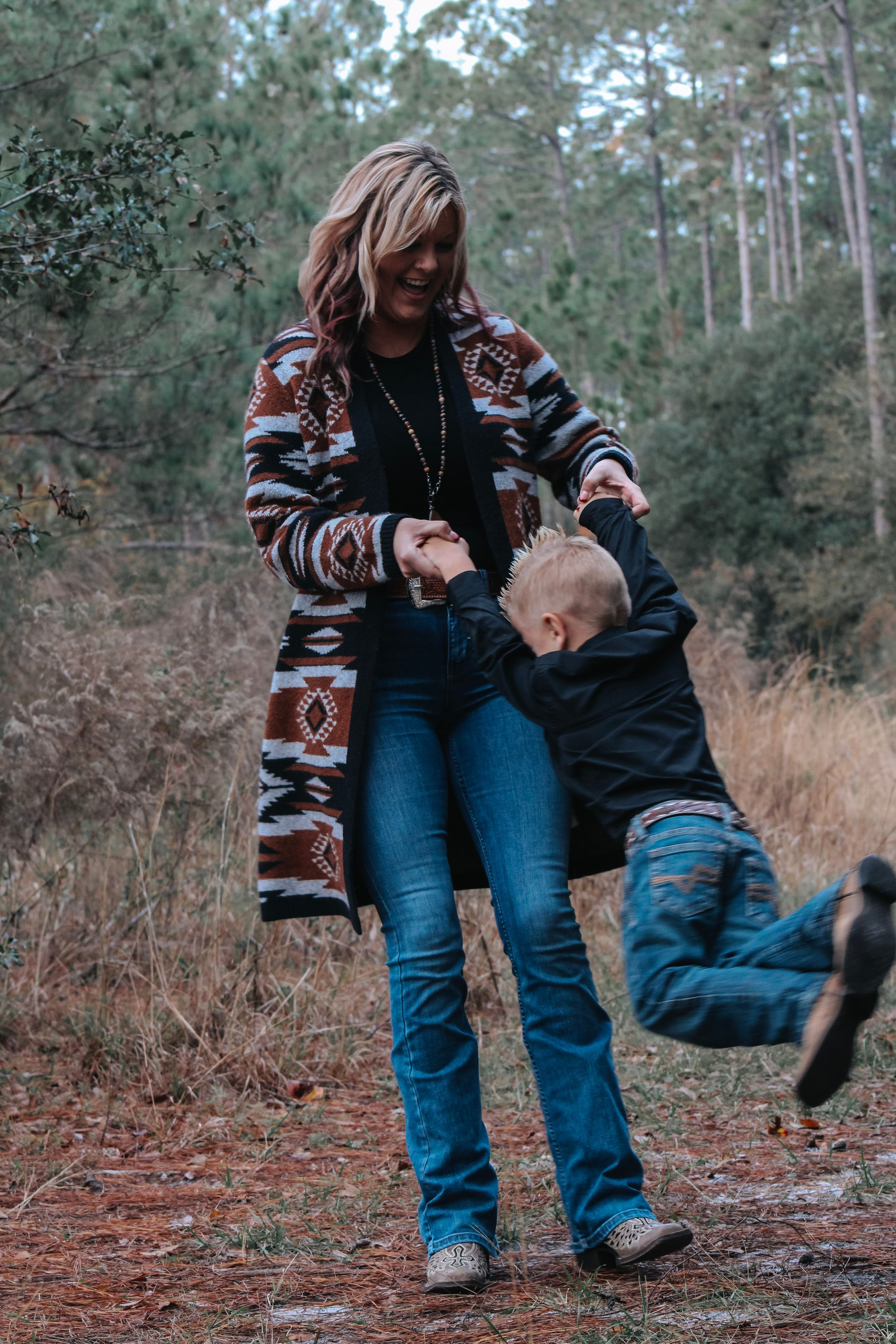 Playful sequence of two people laughing and having fun outdoors in casual winter clothing.