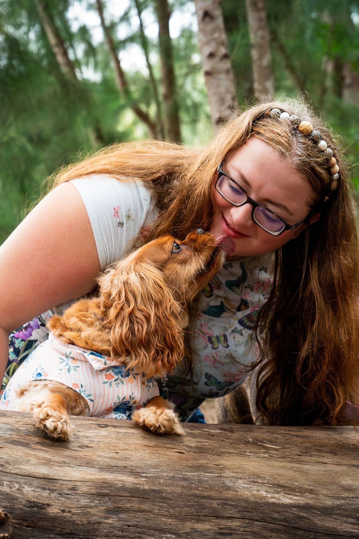 Mom sitting with her dogs during a relaxed lifestyle portrait session, heartfelt pet and family photography by SRX Media Group in S. Florida