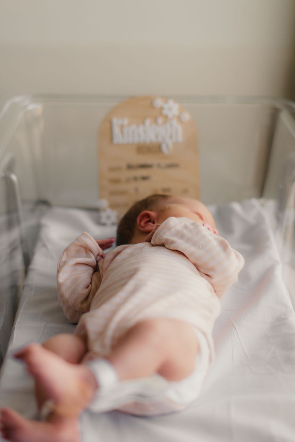 newborn in hospital bassinet captured by Maryland Newborn Photographer Mallory Bramlett.