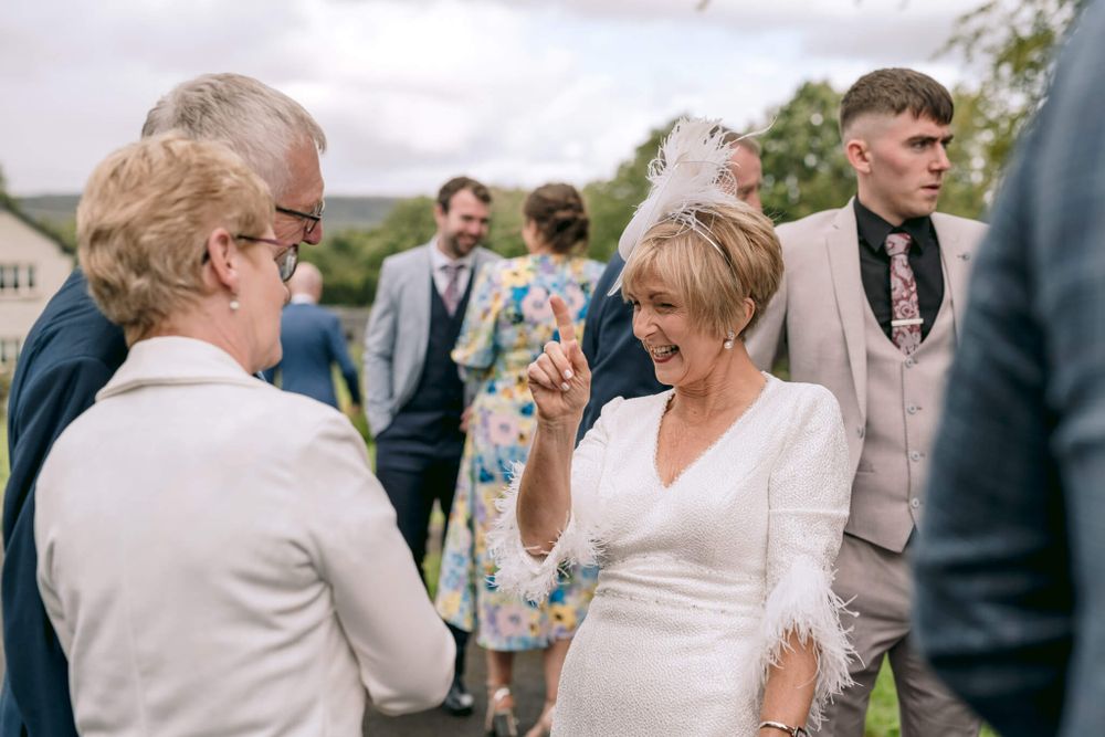 Joyful wedding celebration candid moment captured during outdoor reception.