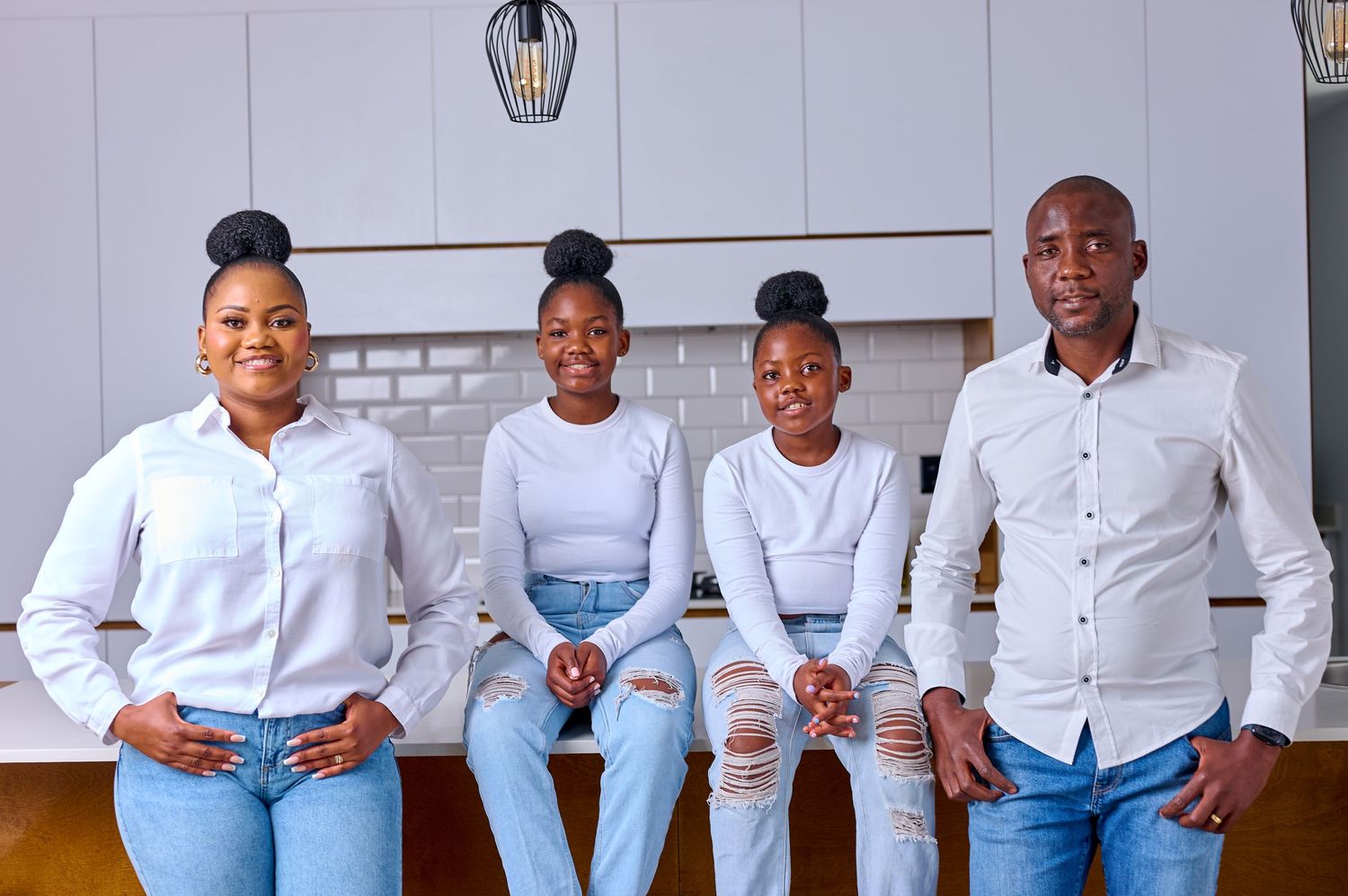 family wearing white and denim jeans