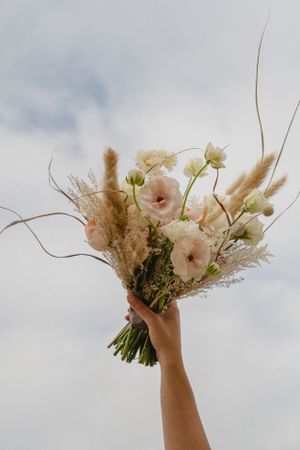 Bride is holding bouquet