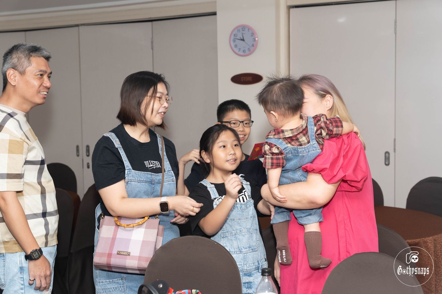 Family gathering in home interior during celebration event.