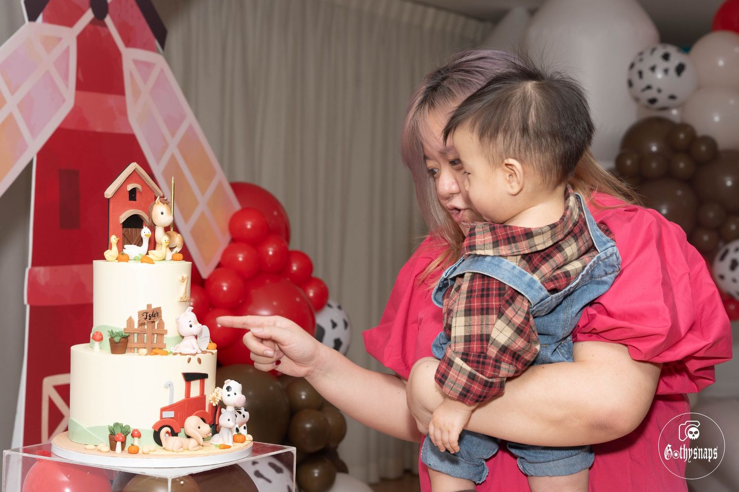 Celebrating with tiered farmhouse themed birthday cake at party.