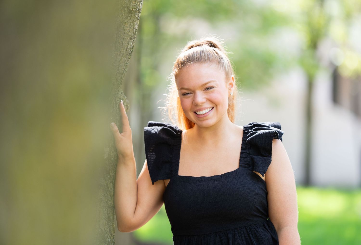 Outdoor portrait session in a natural garden setting.