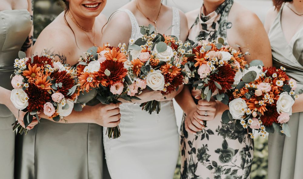 an array of fall florals and wild flowers created by godley flowers and gifts