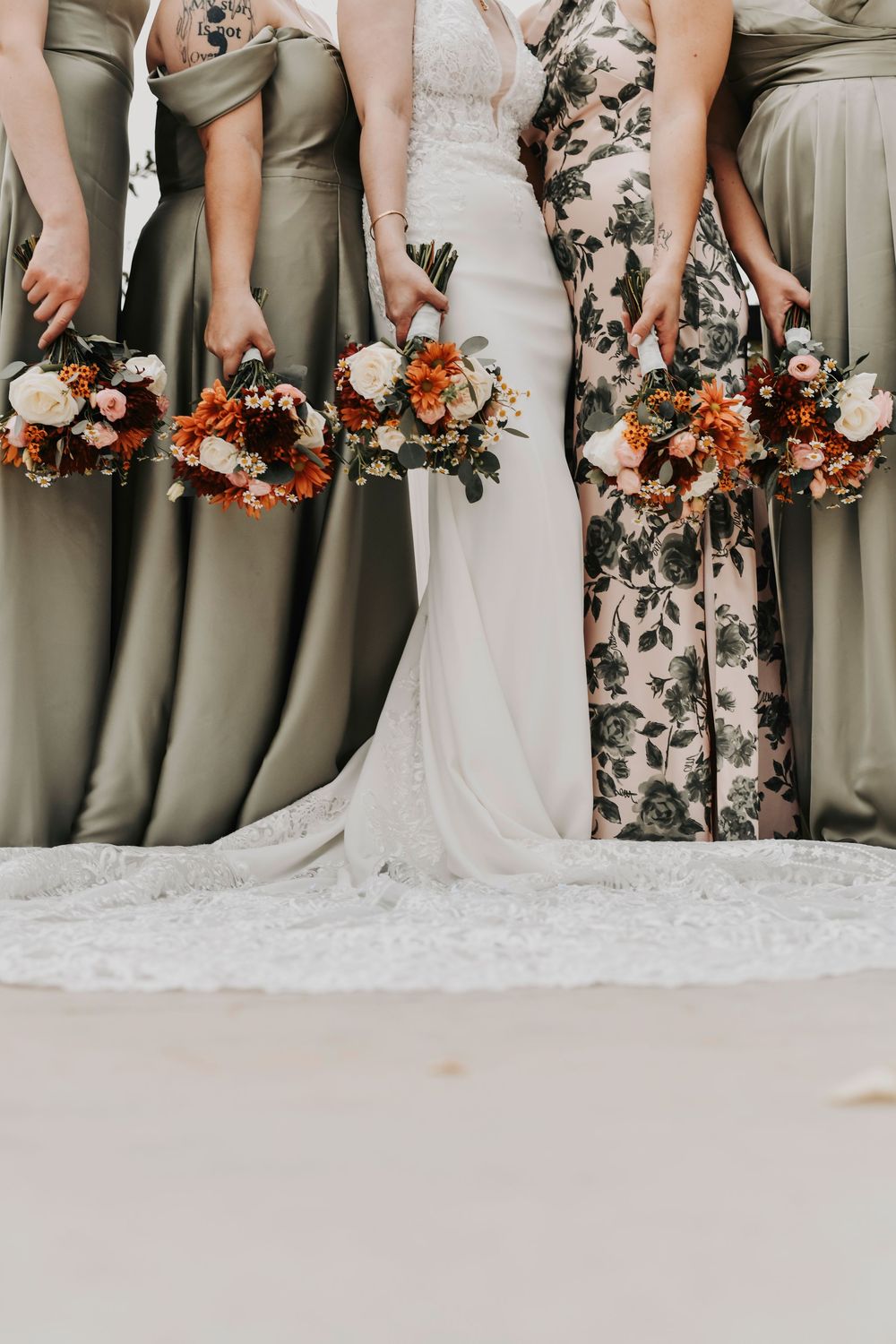 the bridal party in green and botanical florals