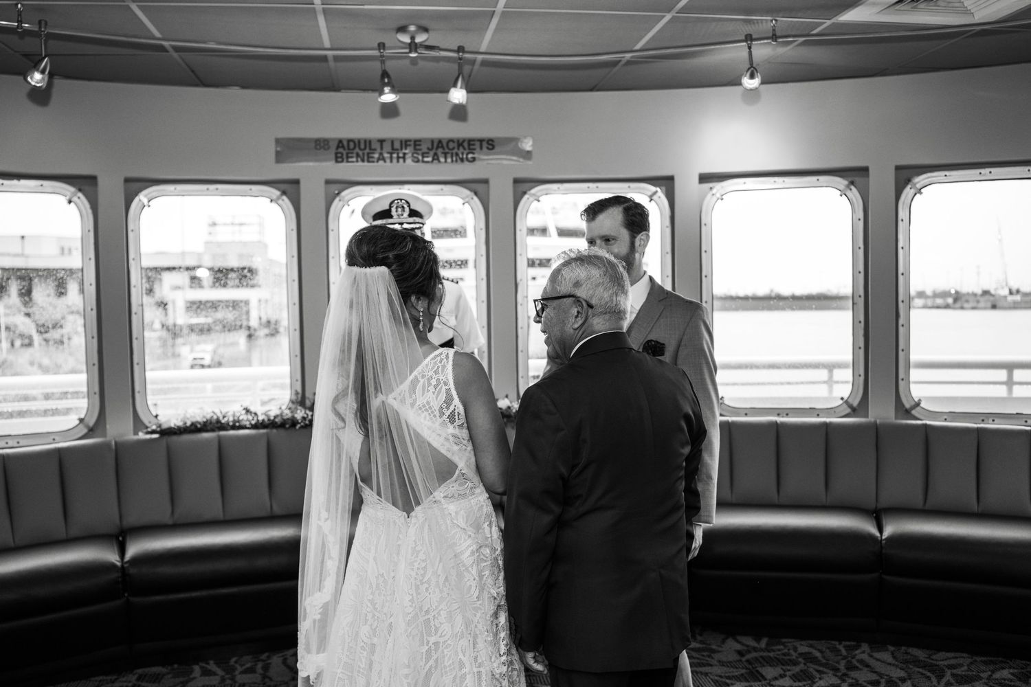 Black and white wedding reception photos showing guests mingling and dancing on a boat venue. Micro wedding on Yacht StarShip in Tampa