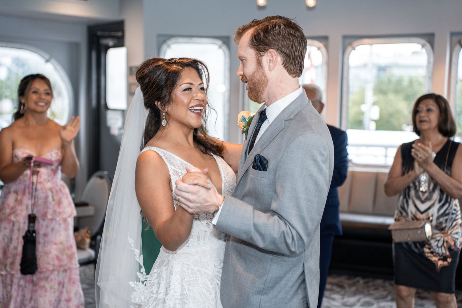 Wedding celebration aboard a yacht with guests mingling and dancing. Micro wedding on Yacht StarShip in Tampa