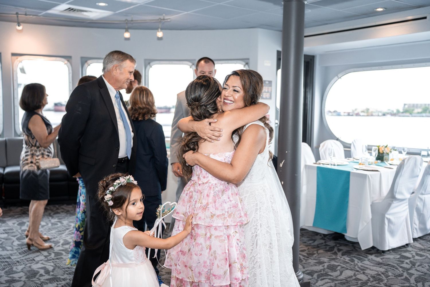 Wedding celebration aboard a boat with guests dancing and enjoying festivities in natural light. Micro wedding on Yacht StarShip in Tampa