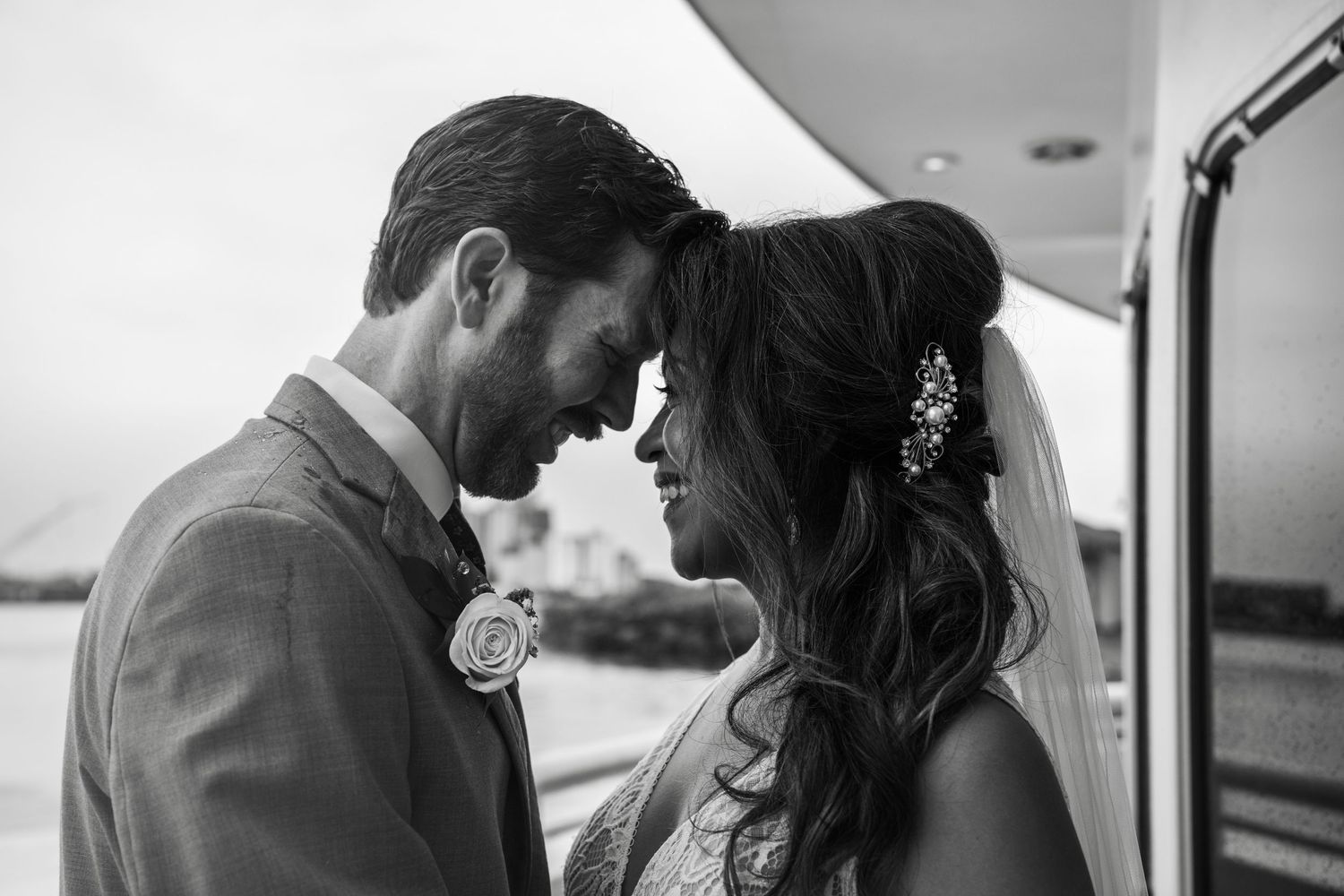 Romantic black and white wedding photos showing tender moments between newlyweds. Micro wedding on Yacht StarShip in Tampa
