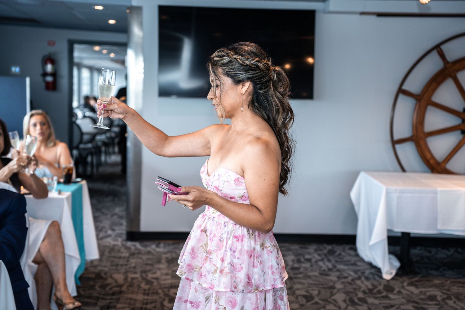 Wedding party members share joyful moments in an elegant indoor reception space. Micro wedding on Yacht StarShip in Tampa