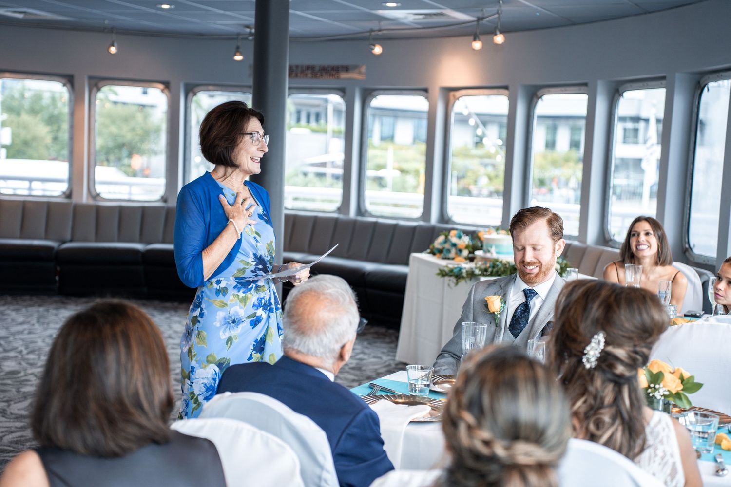 Guests celebrating at a nautical wedding reception with waterfront views. Micro wedding on Yacht StarShip in Tampa