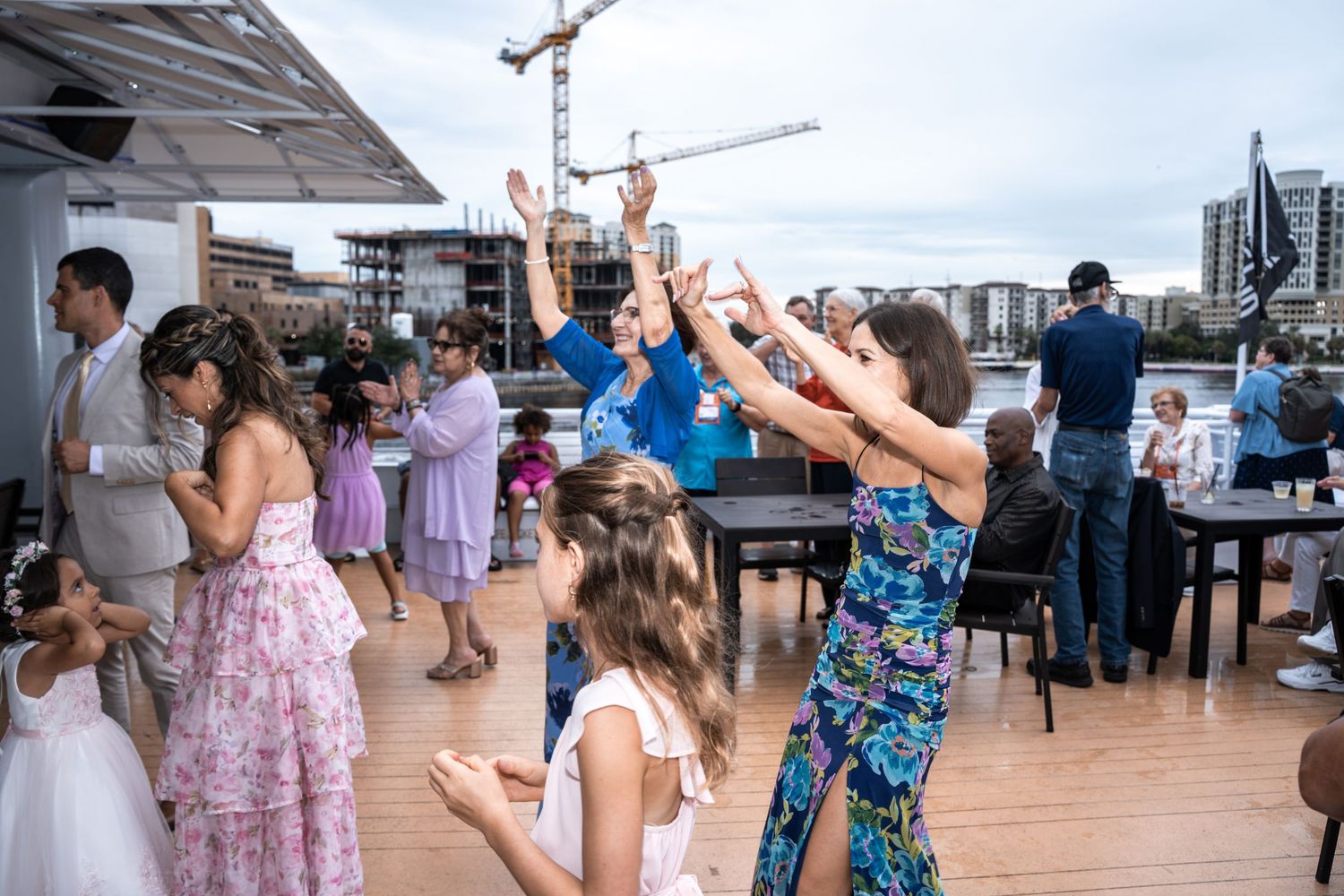 Wedding reception venue with guests dancing and celebrating on an outdoor deck Yacht StarShip in Tampa Fl