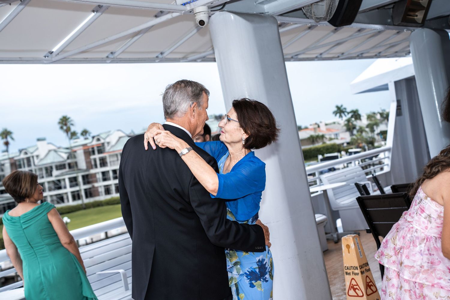 Wedding celebration on a boat deck with couples dancing and embracing Yacht StarShip in Tampa Fl