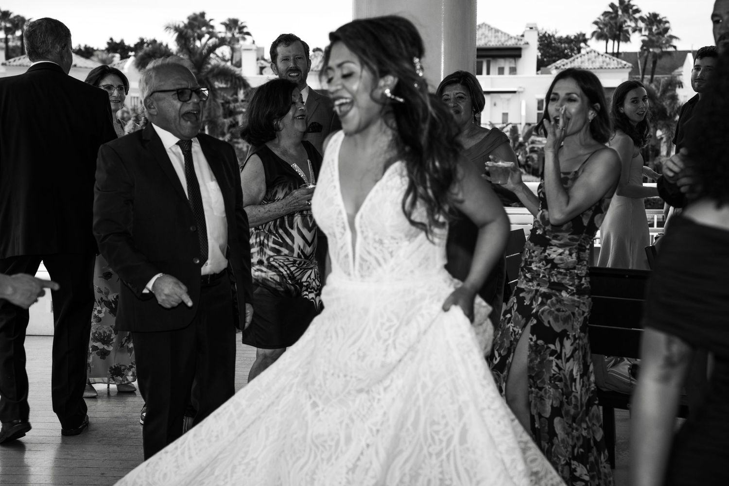 Black and white photo of wedding guests dancing and celebrating on a boat Yacht StarShip in Tampa Fl