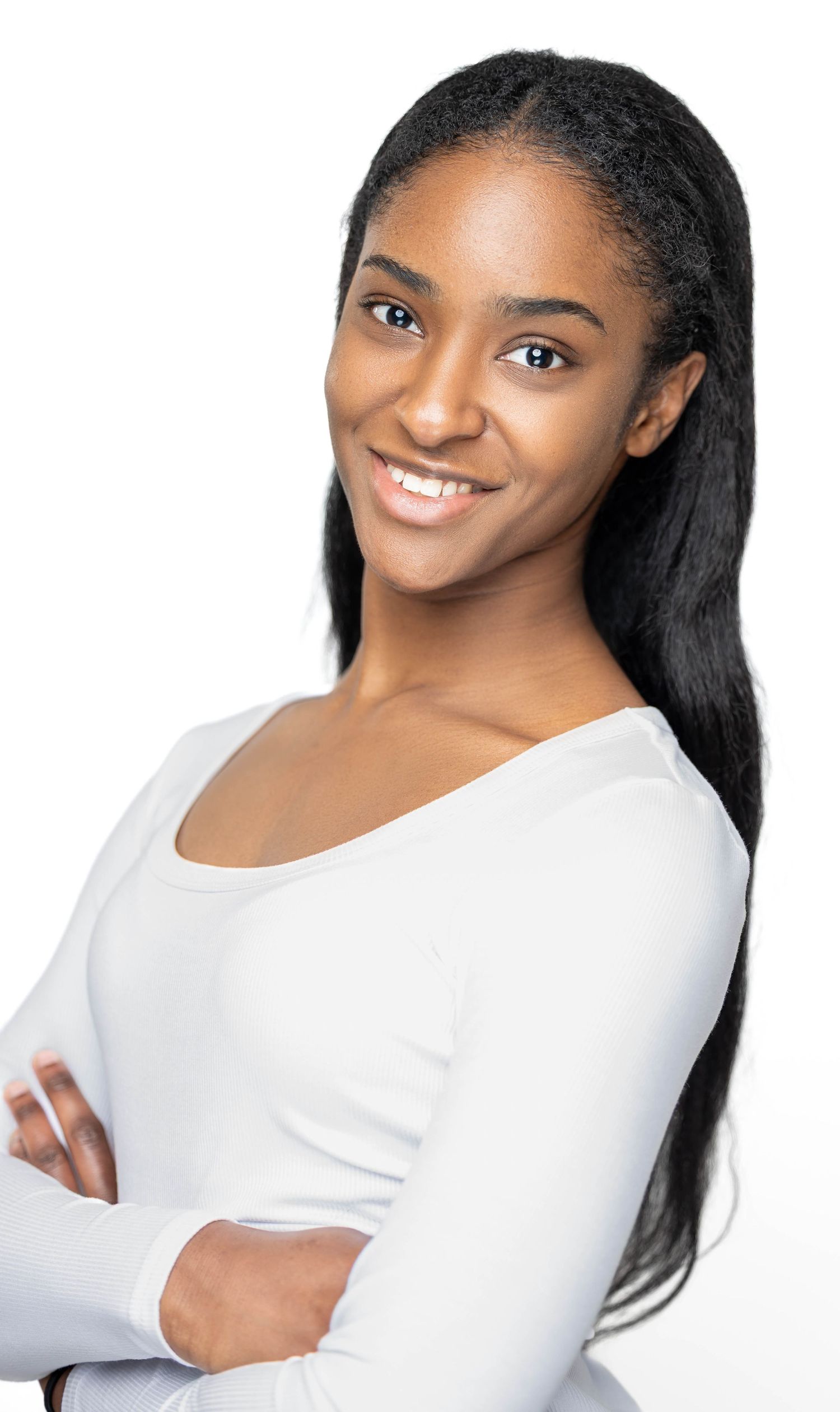A person in a white long-sleeve top poses in a sequence of four photos against a white background.