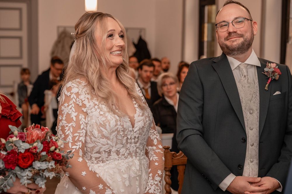 Wedding ceremony photos showing couples in formal attire celebrating in an elegant indoor venue with floral decorations.