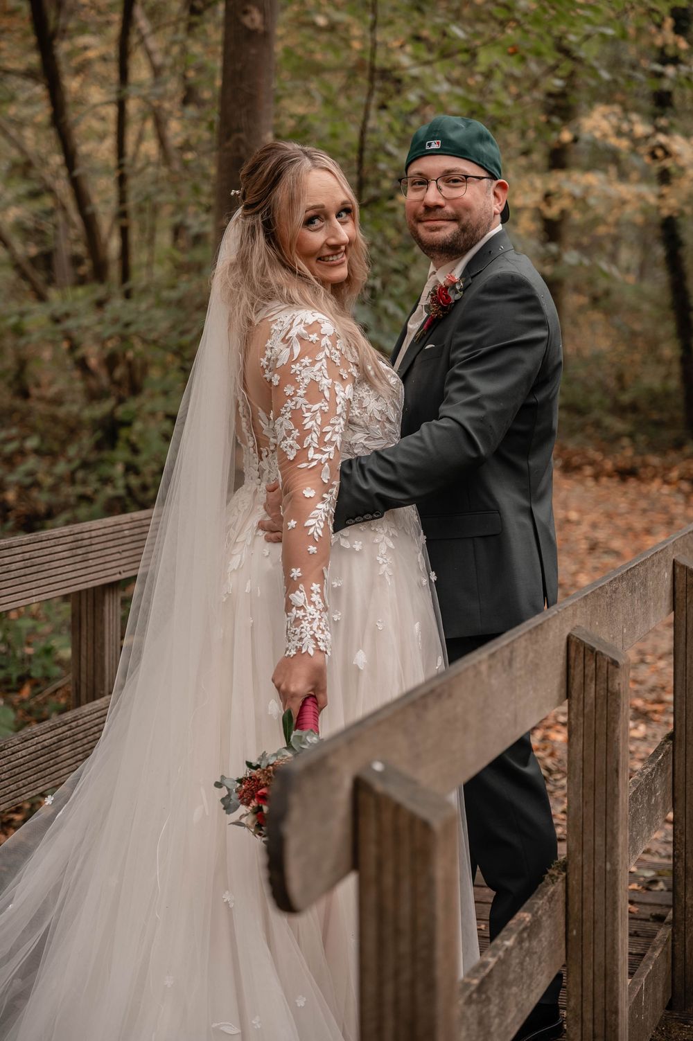 A romantic wedding photoshoot sequence on a wooden deck surrounded by autumn foliage.