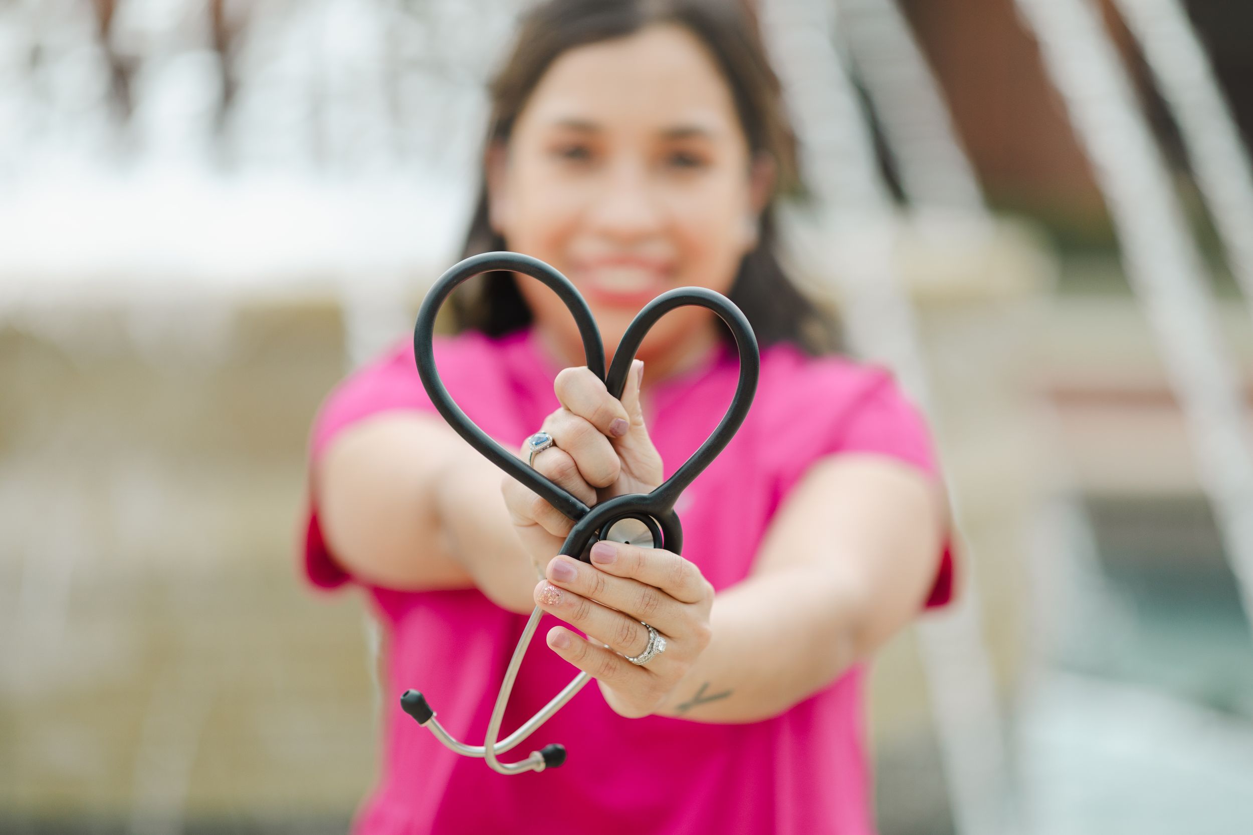 Close-up shot of hands holding medical equipment against blurred background.