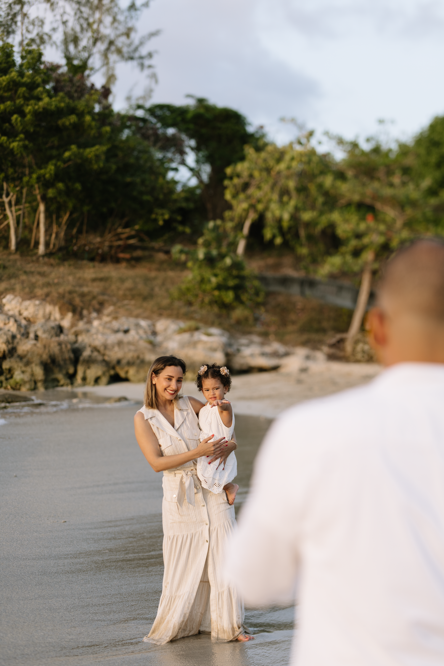 Family photography in Punta Cana with tropical setting and ocean views. Bright, natural images full of warmth and authenticity.