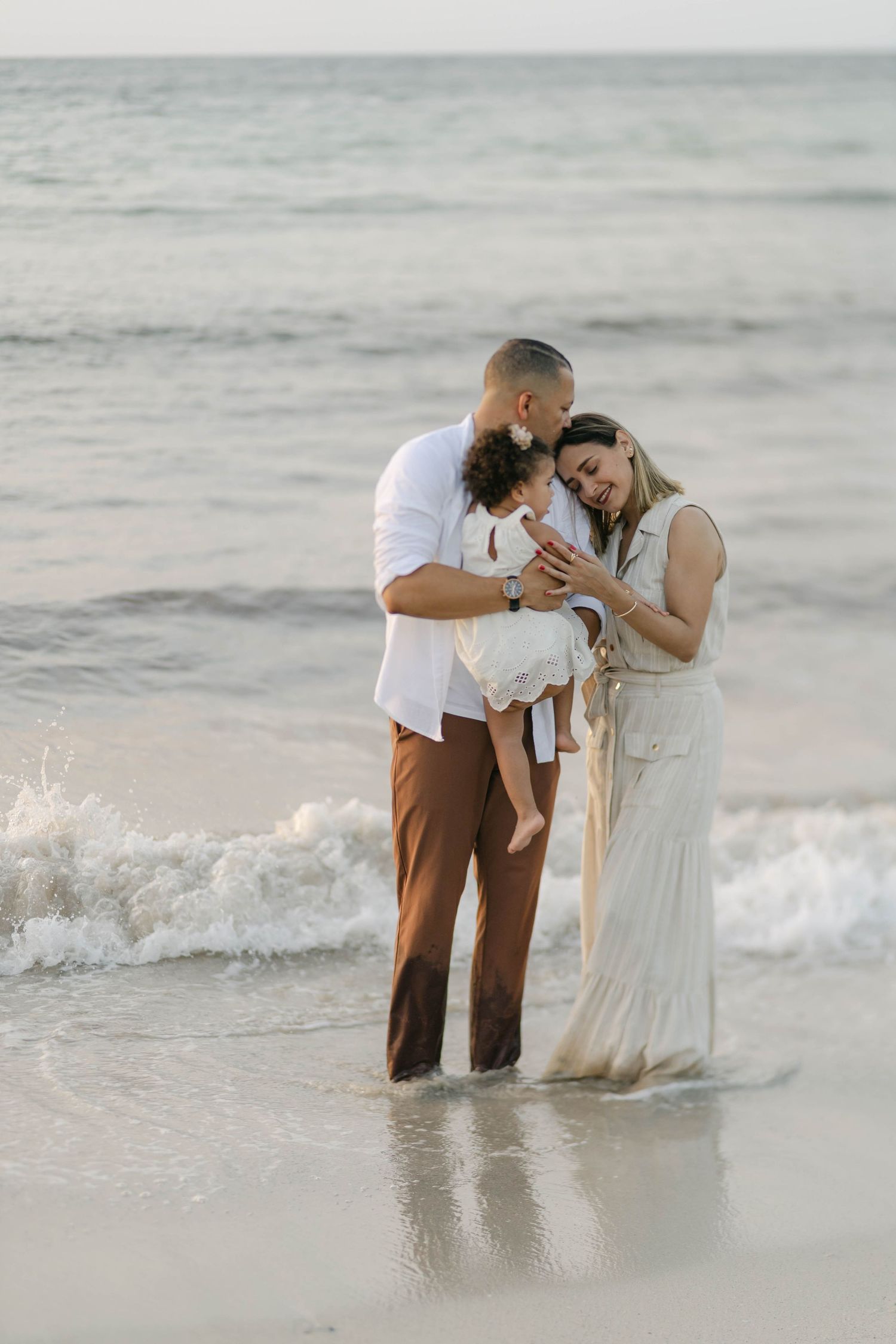 Family session in Cap Cana with sunset glow and coastal backdrop. Warm, emotional photos that preserve special memories.