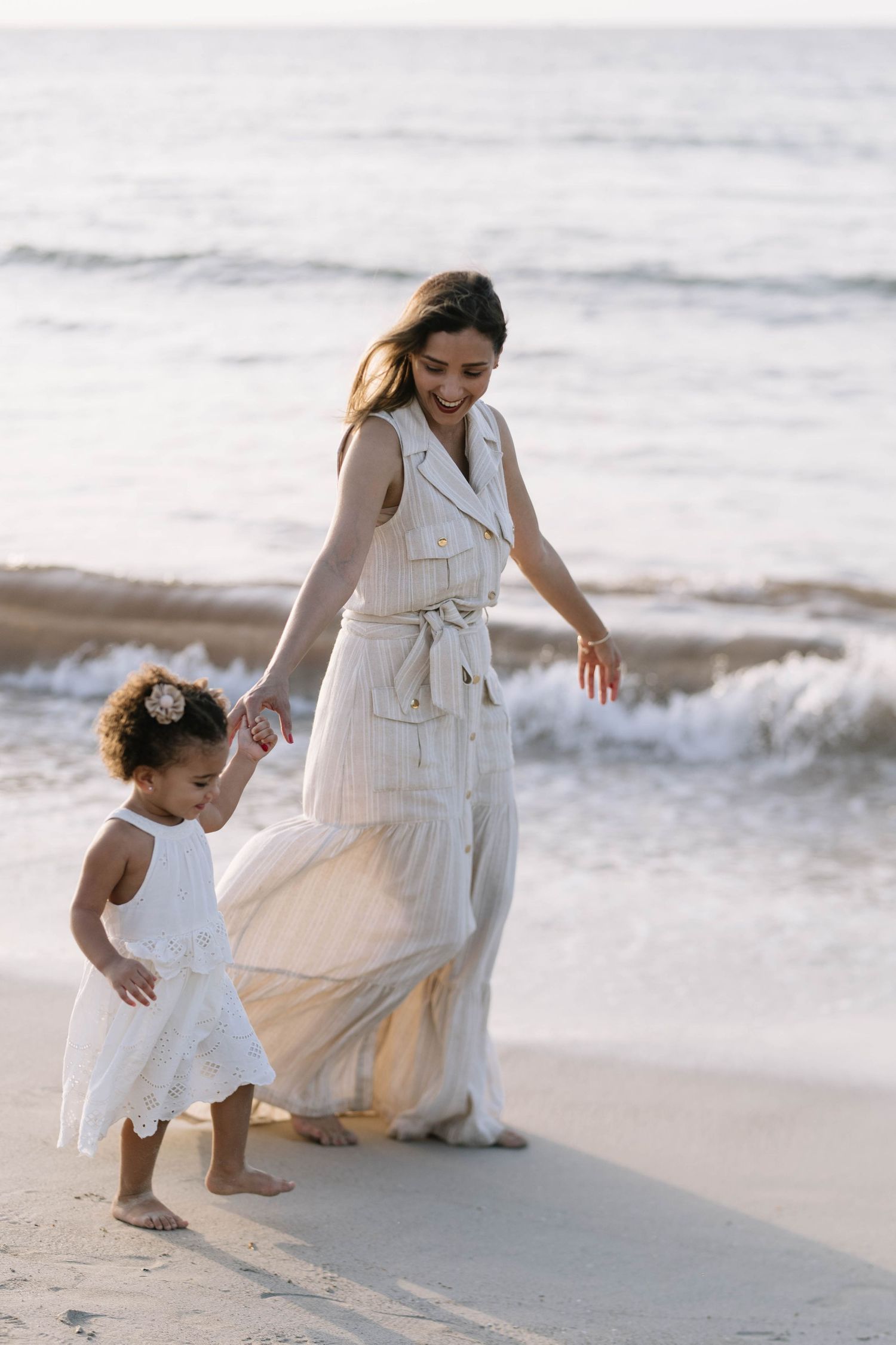 Family photos in Punta Cana with beach backdrop and natural light. Candid, relaxed moments capturing genuine connection and joy.