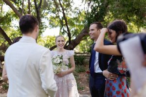Wedding guests gathered outdoors for a celebration moment.