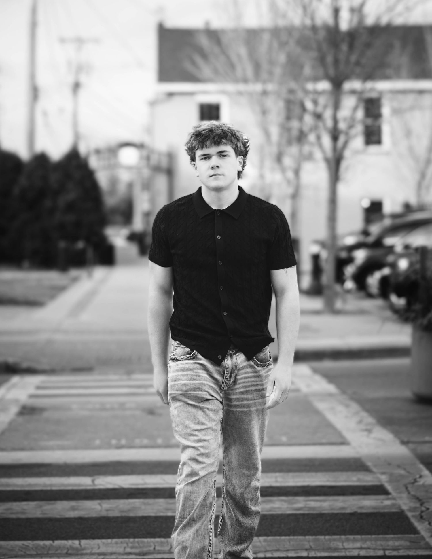 Black and white photo series shows person in casual attire sitting on outdoor steps in urban setting.
