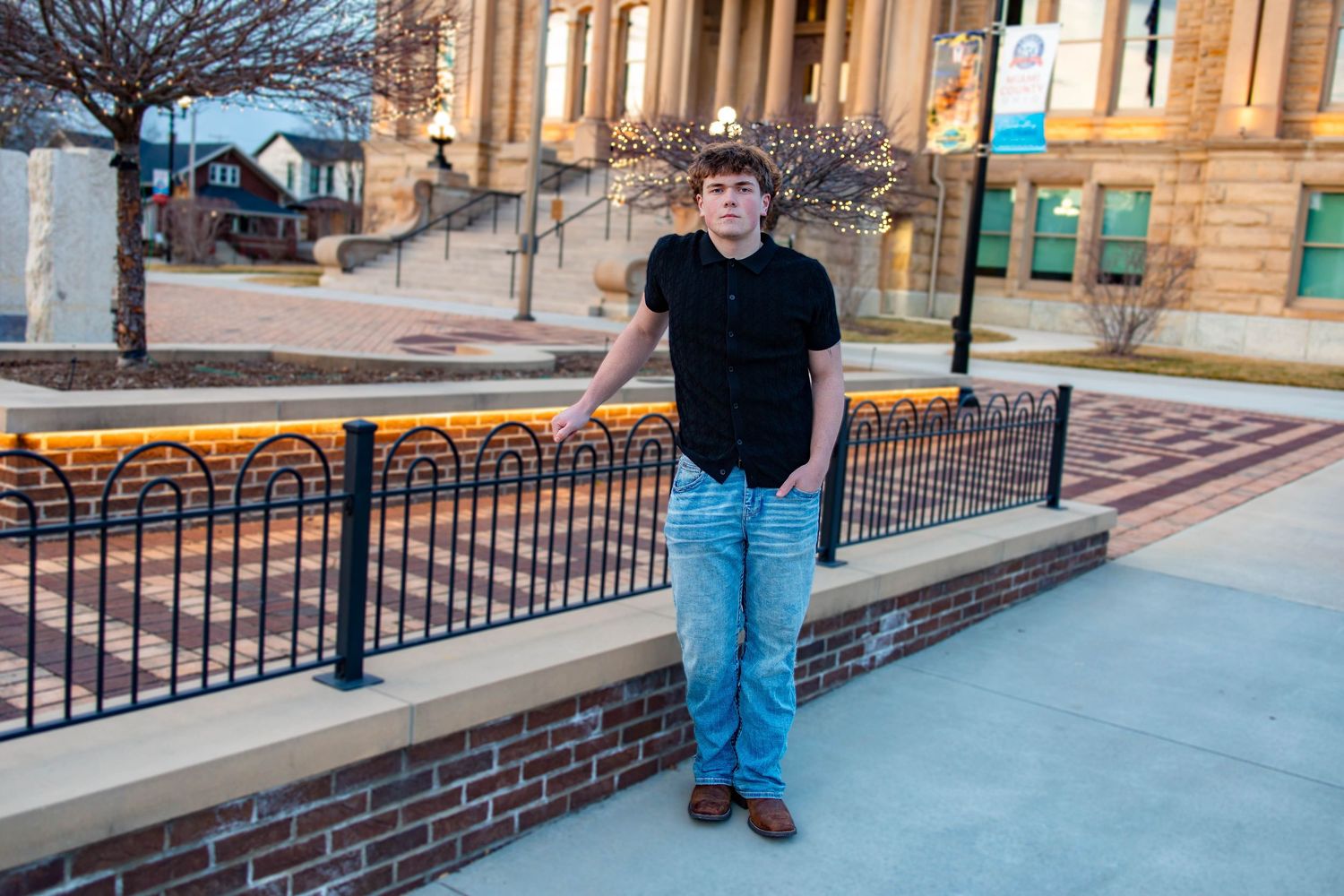A sequence of photos shows someone standing in front of a brick building entrance at different angles and distances.