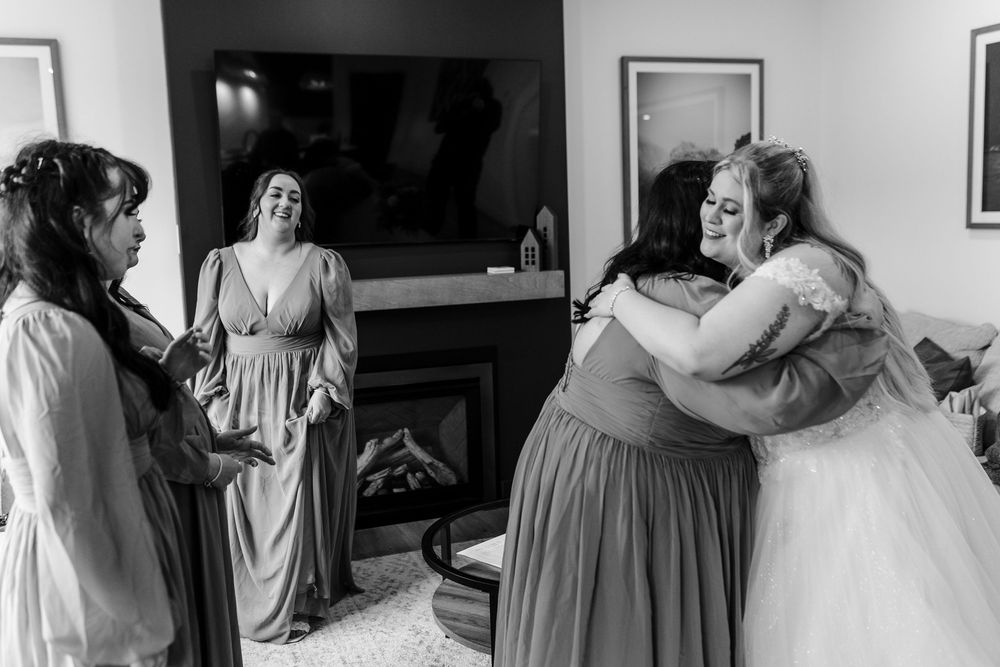A series of black and white photos showing wedding preparation moments with bridesmaids in matching dresses.