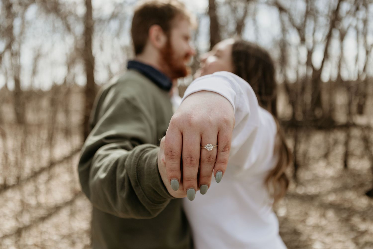 A series of romantic outdoor engagement photos captured in a wooded setting.