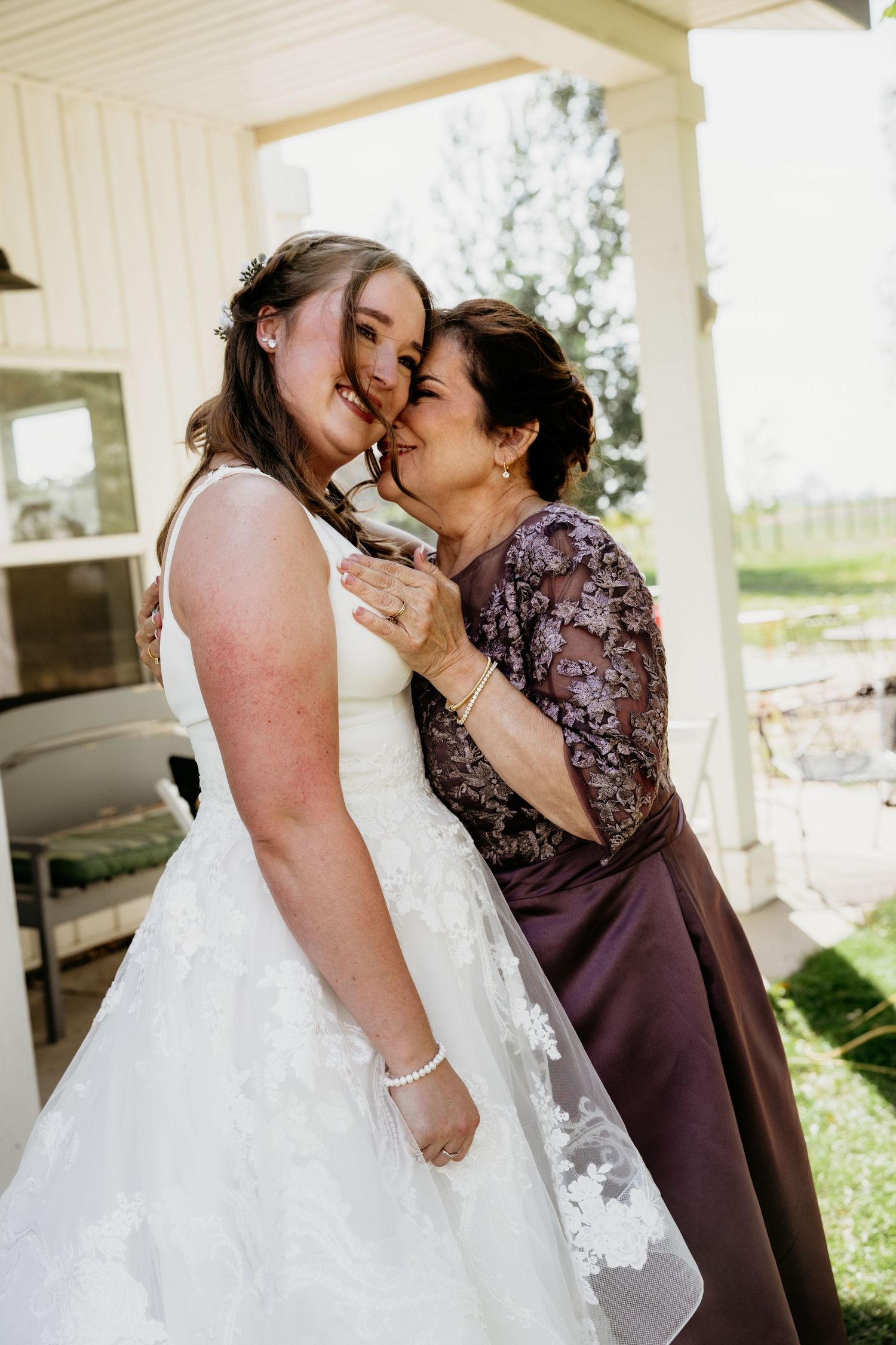 Emotional moments shared between people in formal attire during a wedding day.