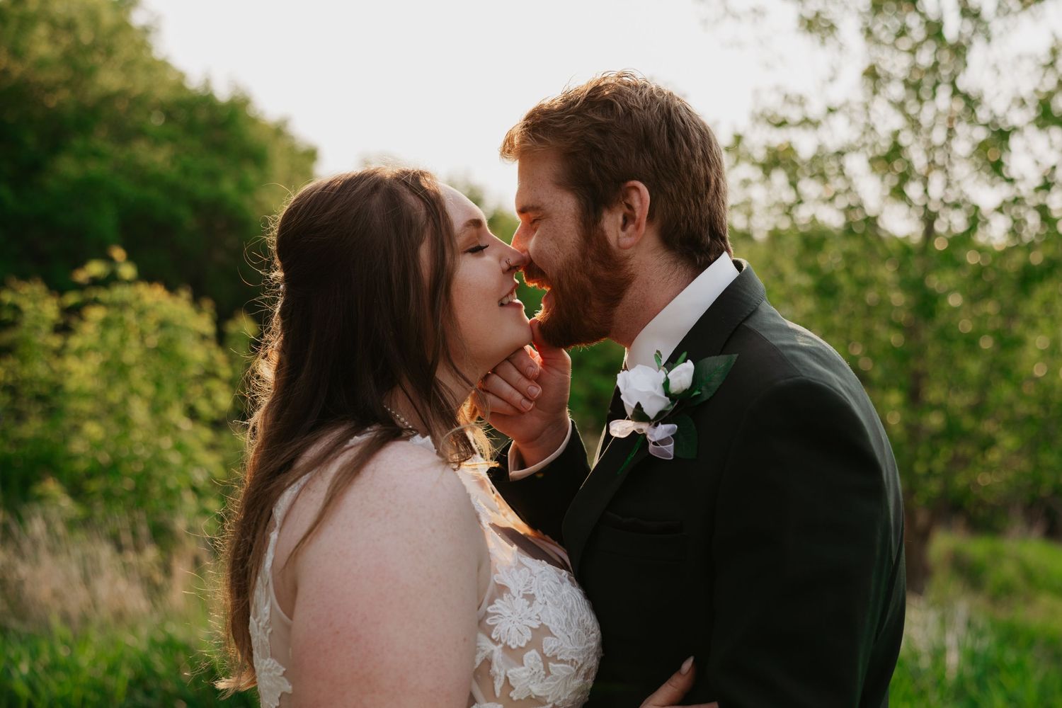Romantic wedding photos of couple sharing intimate moments in outdoor garden setting.