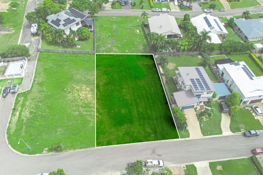 Aerial view of residential neighborhood with green lawns and houses captured by drone camera.