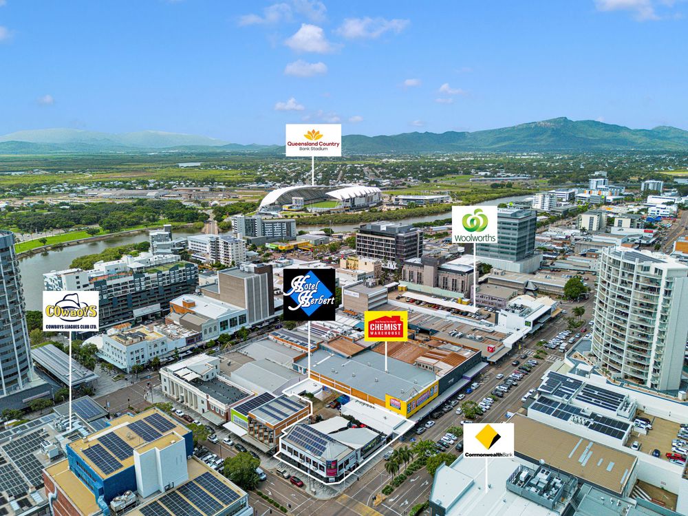 Birds eye view of downtown Townsville showing major retail locations marked with location pins against mountain backdrop.