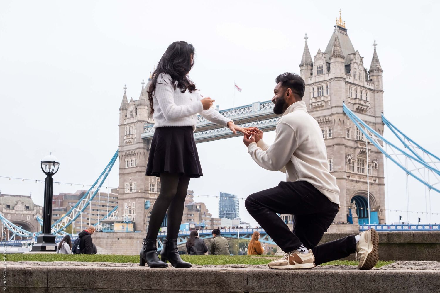 A marriage proposal in front of London's iconic Tower Bridge.