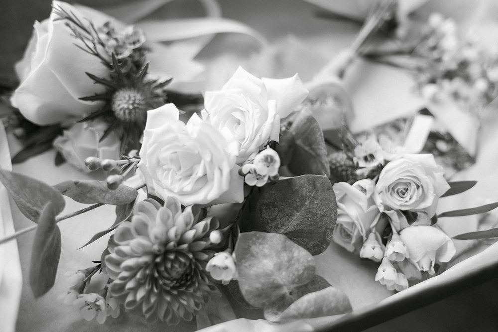 Black and white close-up of delicate wedding flowers and floral arrangements.