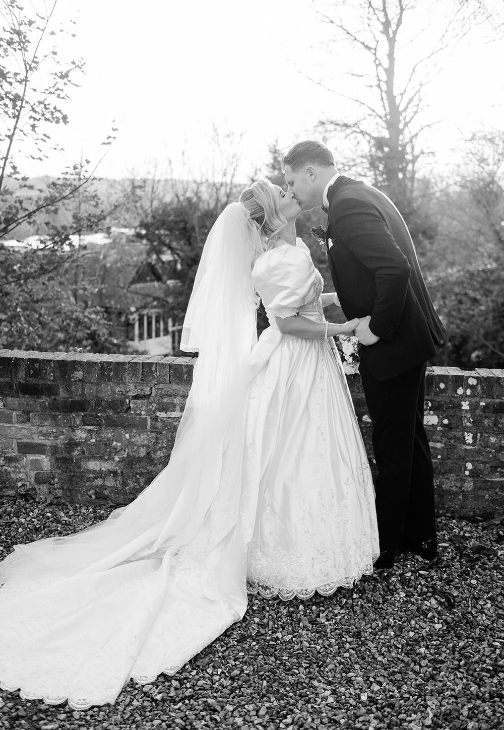 A romantic black and white wedding photo sequence shows a couple dancing together in a garden setting.