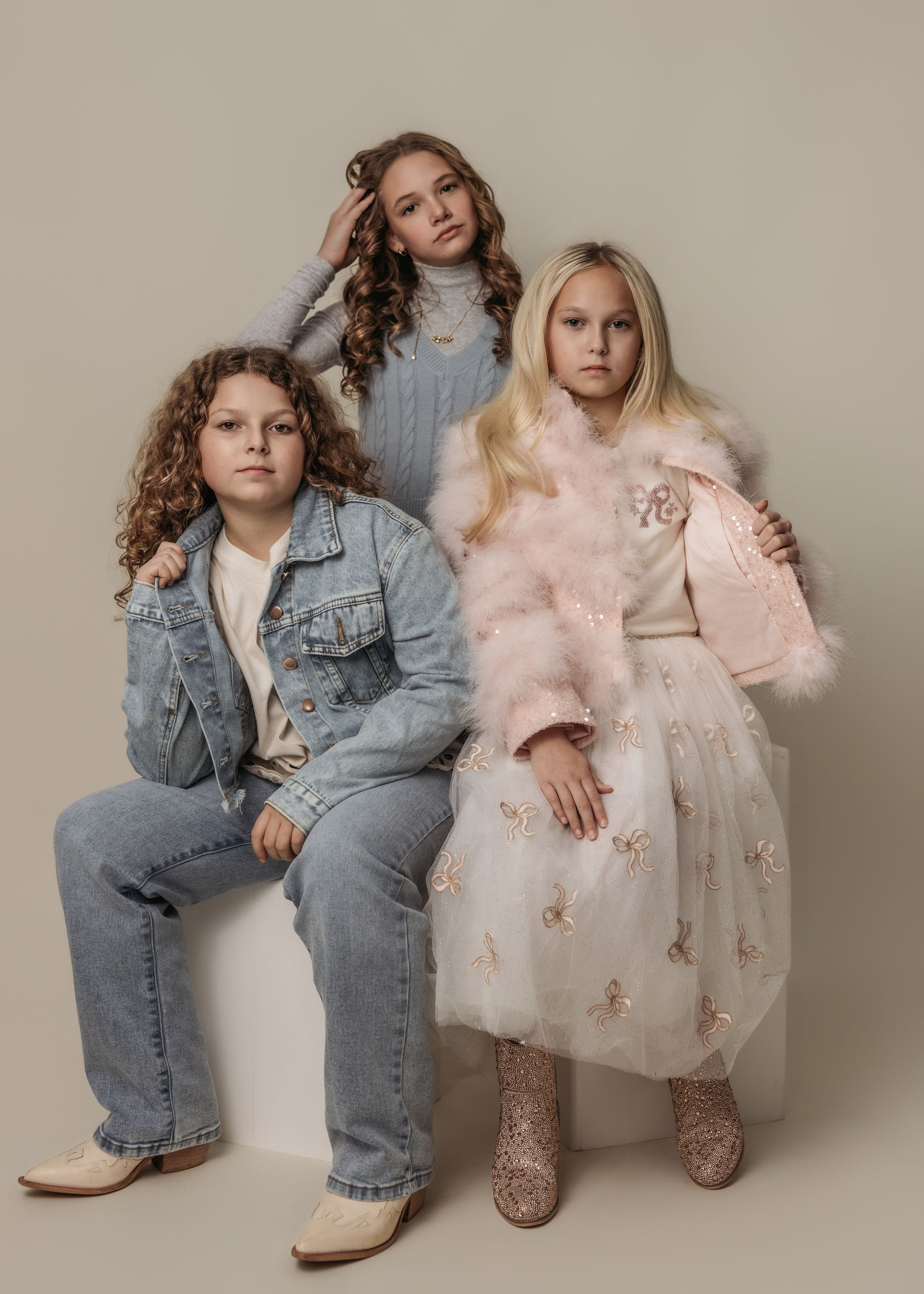 Fashion studio photos showing contrast between denim and delicate pink tulle outfits.
