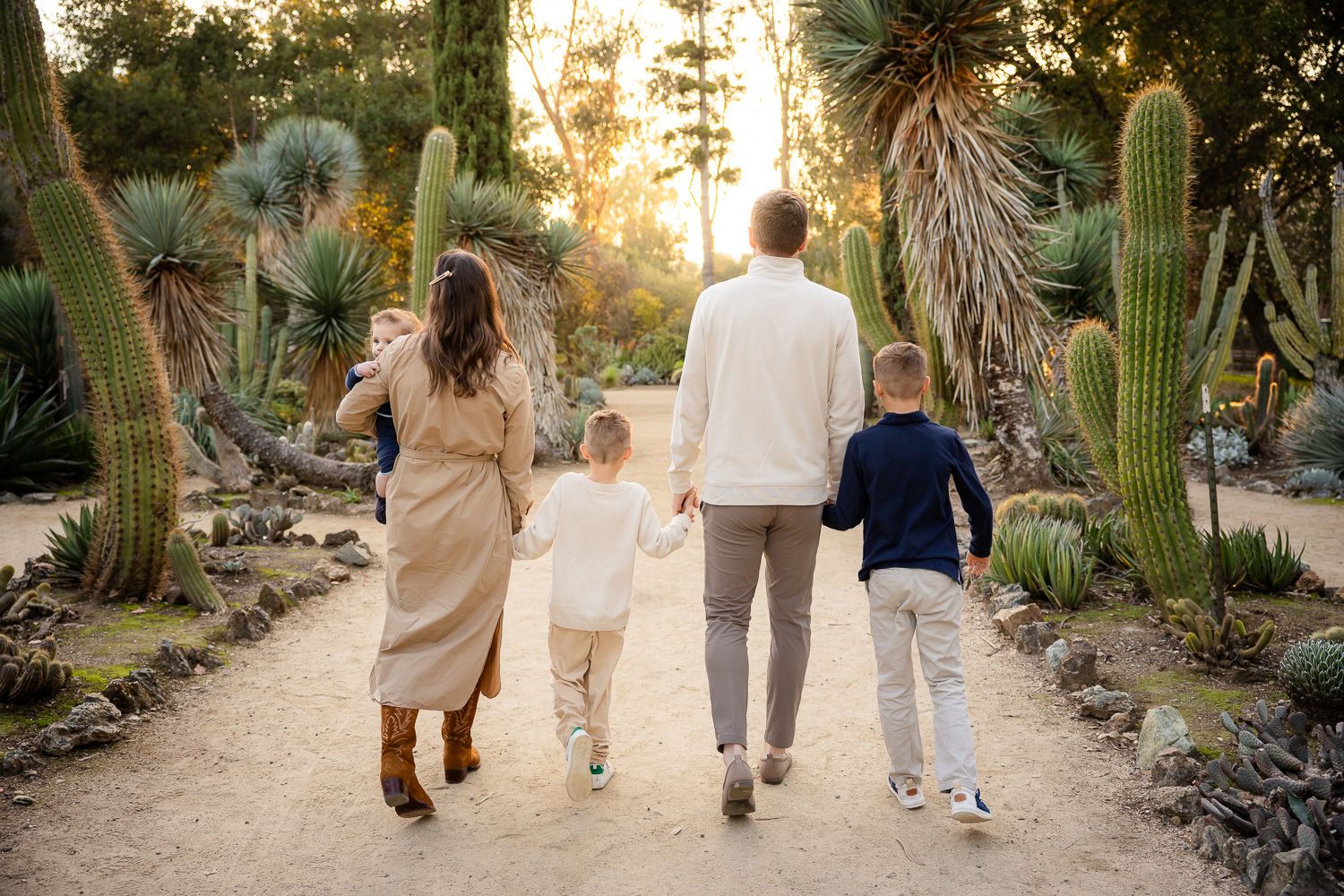 A family of five walks in a cactus garden during their Bay Area family photoshoot