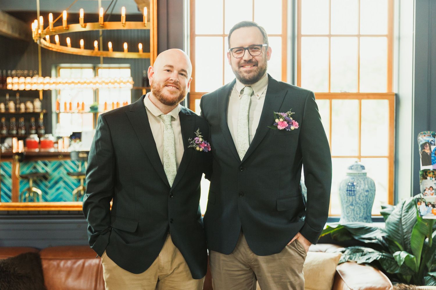Wedding celebration in rustic venue with wooden details and warm lighting.