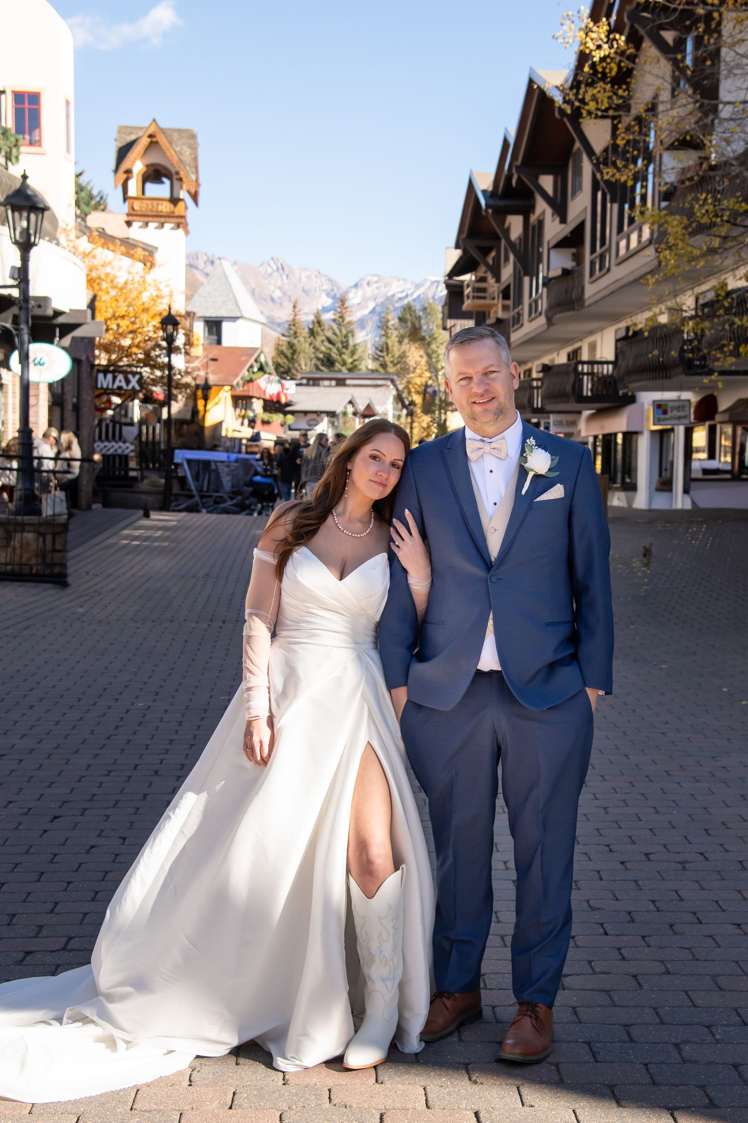 Wedding photos in Vail Village with mountain and village in the background.